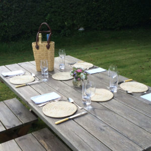 Natural raffia placemats on a garden table