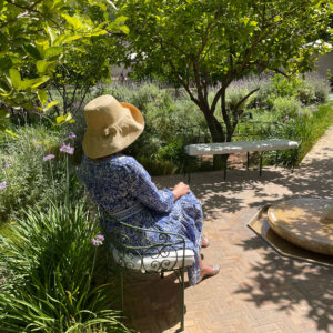 Natural Mimosa Hat being worn in Le Jardin Secret, Marrakech, Morocco