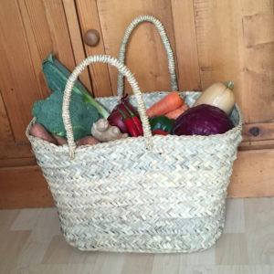 Berber oblong French market basket filled with vegetables