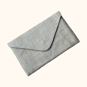 Raffia envelope clutch bag in natural cut out photo
