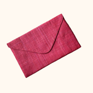 Raffia envelope clutch bag in red cut out photo