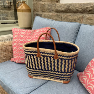 Large blue drawstring shopper basket in conservatory