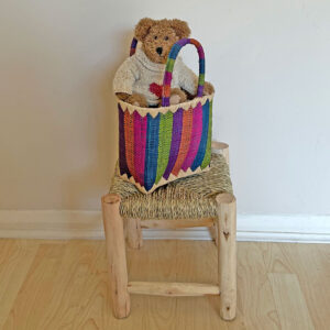 Mini zaza in blue stripes with a teddy on a little wooden stool