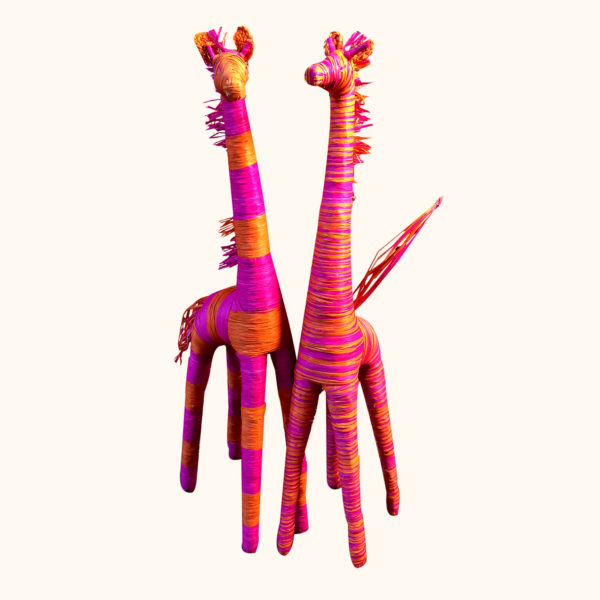 Orange and pink raffia giraffes, cut out photo