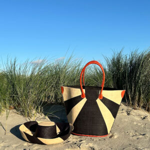 Black sunburst raffia tote bag with Eliza hat at beach