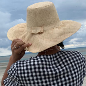 Flat Wide Brim Raffia Hat being worn at the beach
