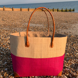 Large Hanta Two Tone Basket in natural and pink on the beach