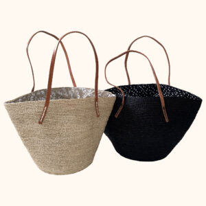 Crochet bags in natural and black with cotton drawstring closures, cut out photo