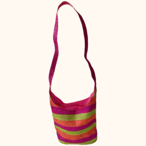 Striped crossbody raffia bag in bright colours cut out photo