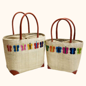 Set of 2 raffia tote bags with different colour butterflies embroidered around the top rim - cut out photo