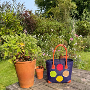 Small navy circles tote bag in the garden