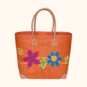Large orange tote bag with flowers and swirls embroidered on both sides, leather handles and a drawstring top