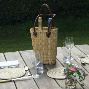 Two bottle reed basket on alfresco dining table