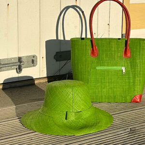 Lime Amelie raffia sun hat at beach with lime Vero handbag