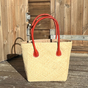 Camille tote bag in natural beside wooden beach hut