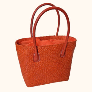 Camille raffia tote bag in orange cut out photo