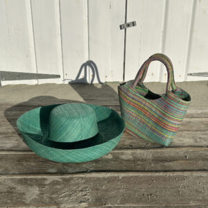 Mimosa raffia Hat in aqua colour and Lillie raffia Handbag in multicolour mint by a beach hut