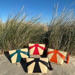 Sunburst Clutch Bags in four colours at the beach