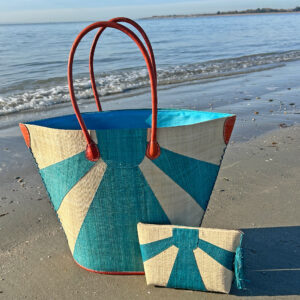 Sunburst Tote Bag and Sunburst Clutch Bag in turquoise at beach